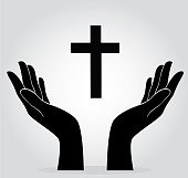 Hands holding up a cross