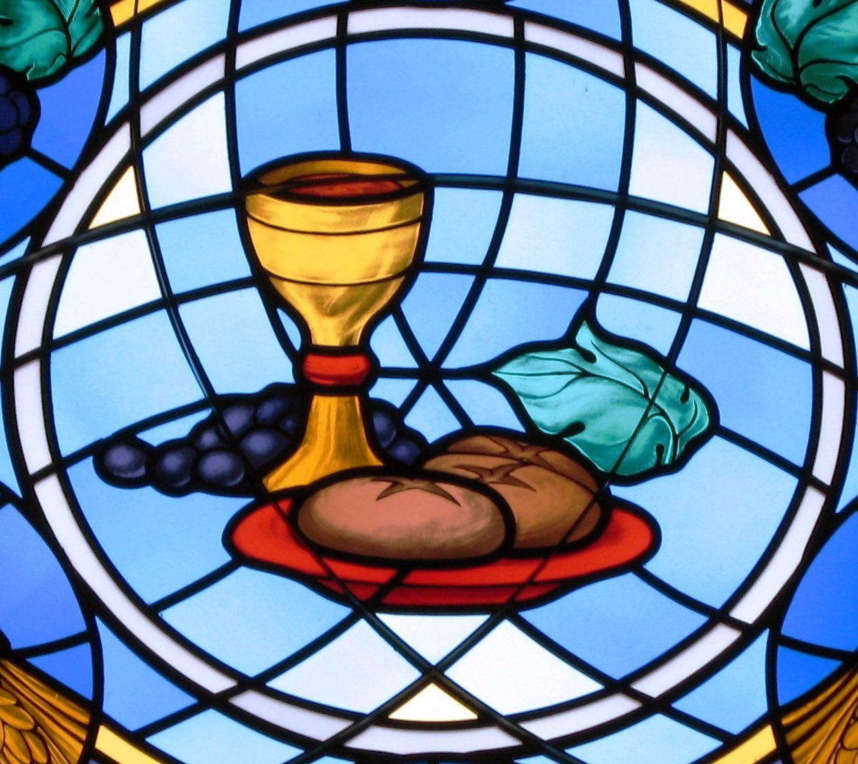 Stained glass window showing Communion