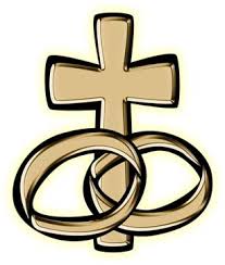 2 wedding rings and a cross