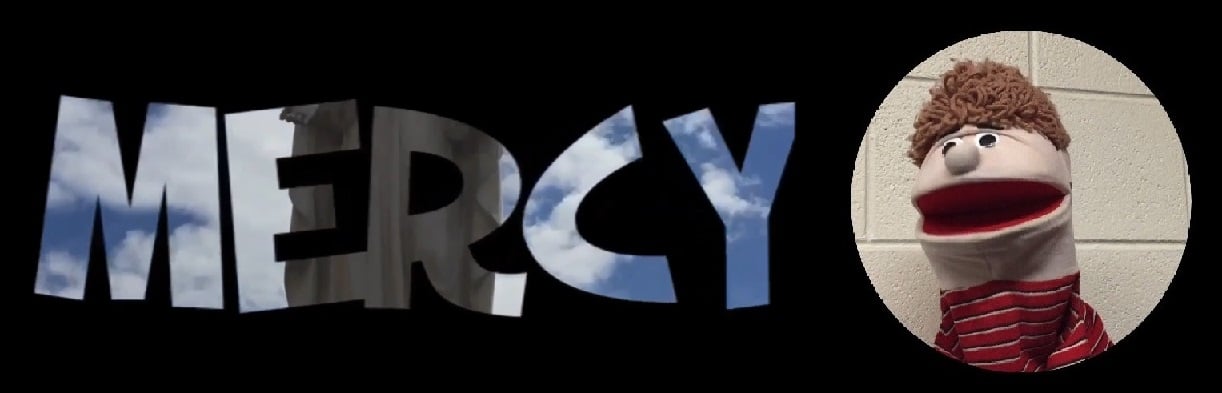 Mercy Video Banner with a puppet named Albert
