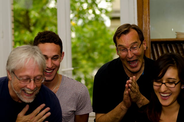 Group of 4 people laughing